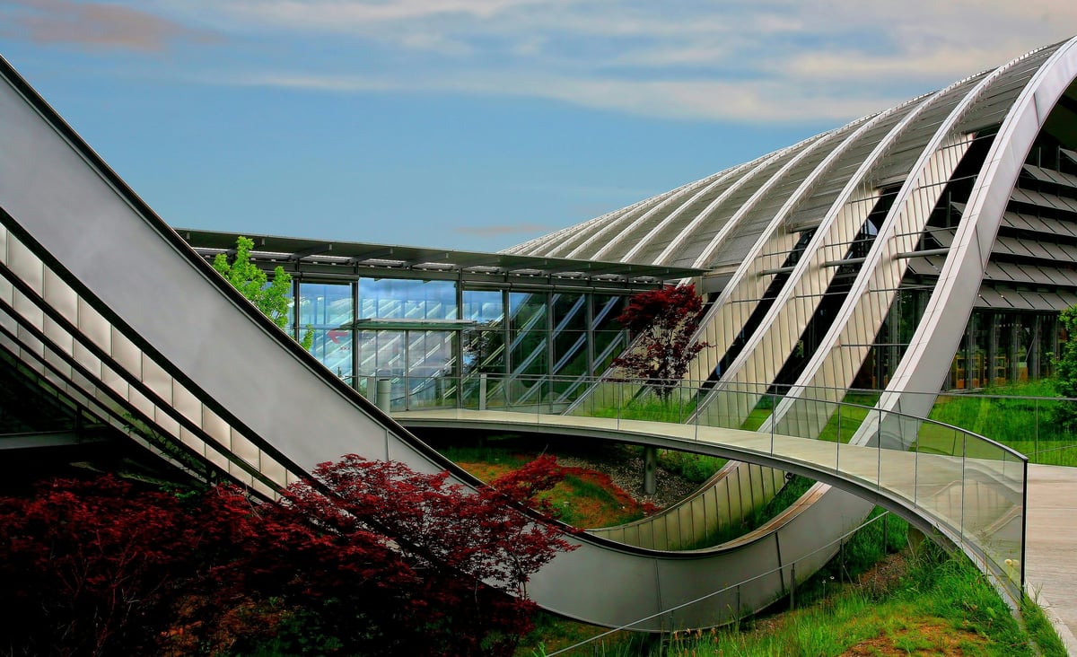 Curved steel and glass architecture with landscaped areas at the Zentrum Paul Klee in Bern
