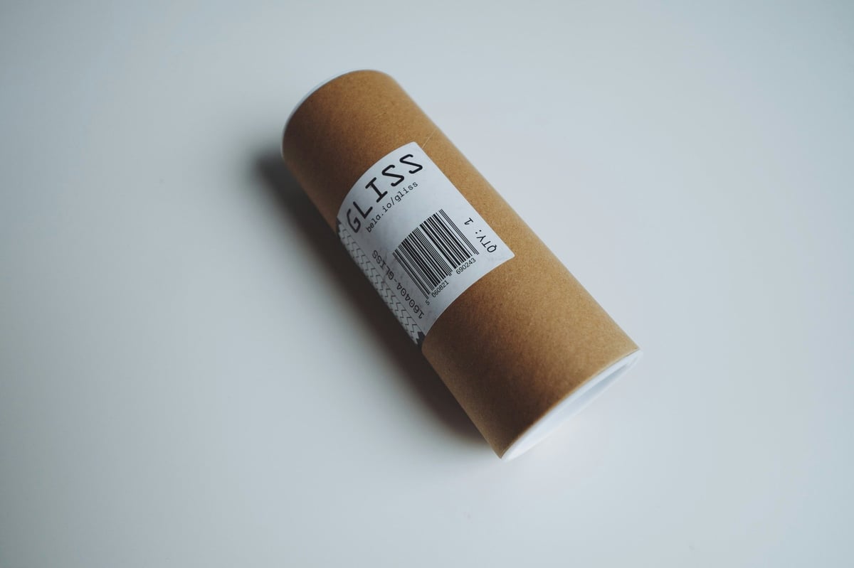 Cylindrical cardboard packaging with a printed barcode label